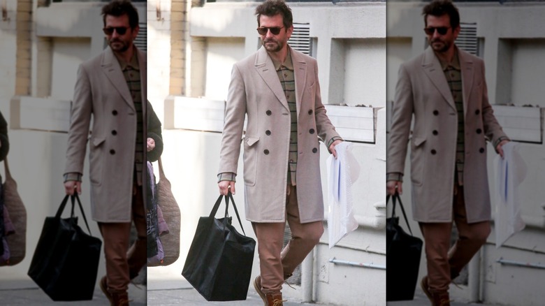 Bradley Cooper in a tan coat