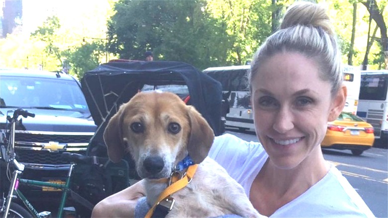 Lara Trump smiling holding beagle