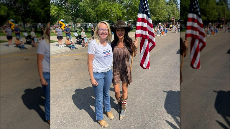 Lauren Boebert holding flag in parade