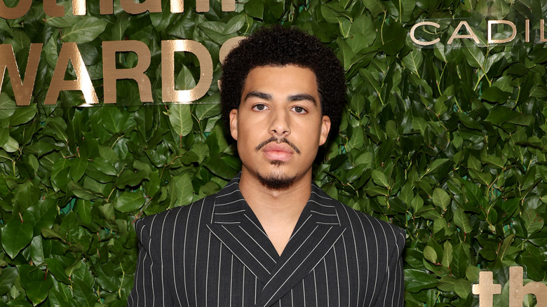 Marcus Scribner black striped suit