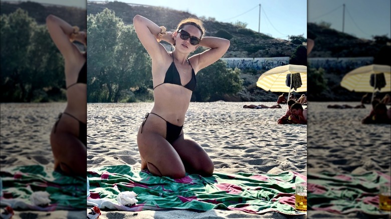 Illeisha Dell sunbathing on beach