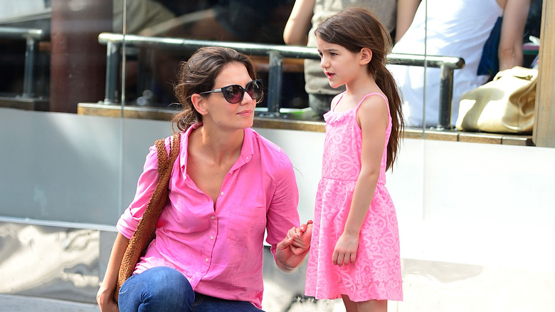 Katie Holmes and Suri Cruise holding hands
