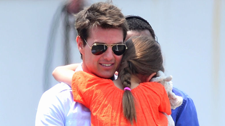 Tom Cruise hugging Suri