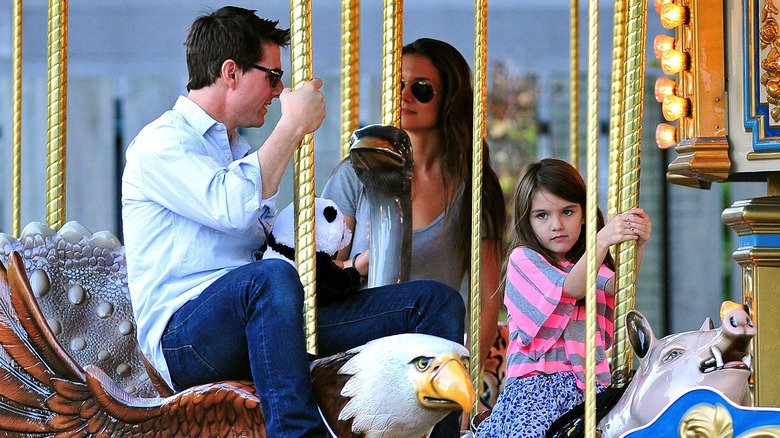 Young Suri Cruise and parents