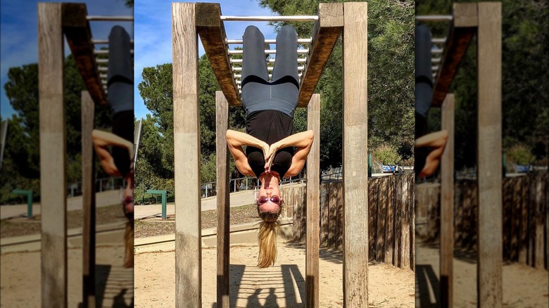 Cynthia Watros practicing yoga outside