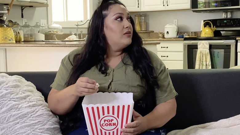 Kalani Faagata eating popcorn