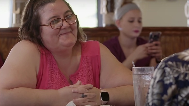 Danielle Jbali smiling across table