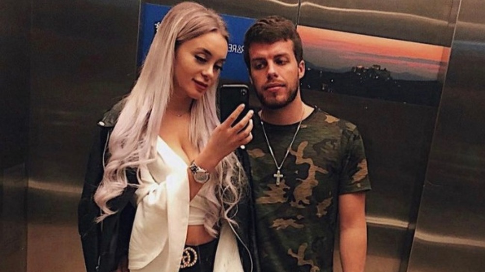 Yara Zaya and Jovi Dufren taking a selfie in an elevator