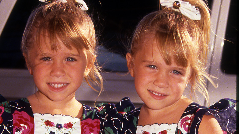 Mary-Kate and Ashley Olsen smiling