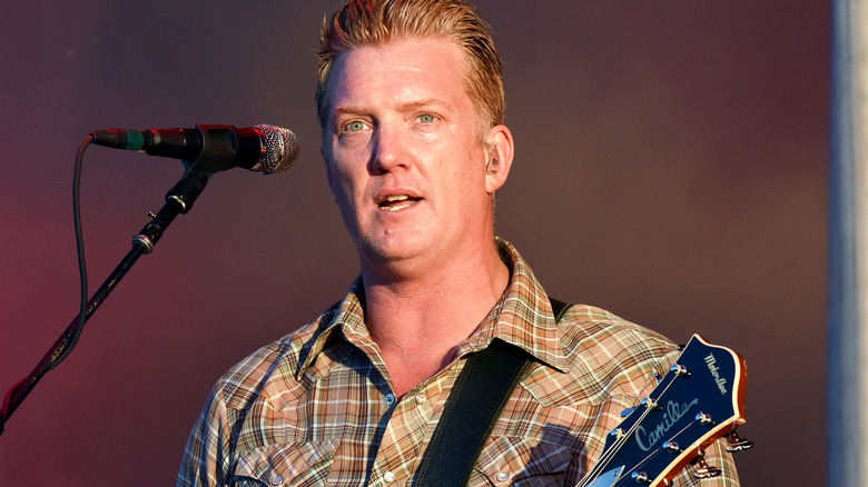 Josh Homme playing guitar 