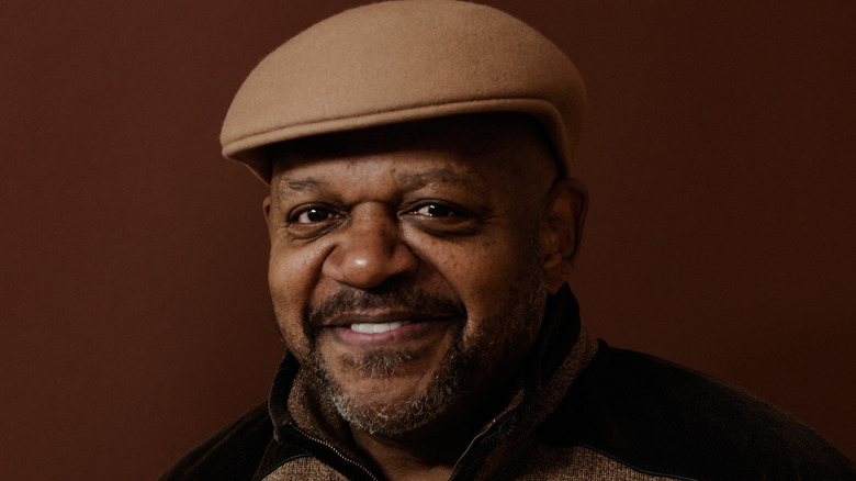 Charles S. Dutton wearing a cap