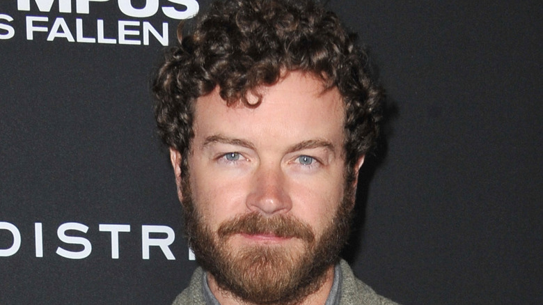 Danny Masterson wearing a gray jacket 