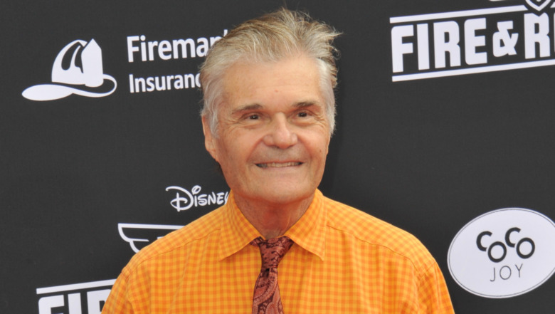 Fred Willard smiling at the Planes: Fire & Rescue premiere