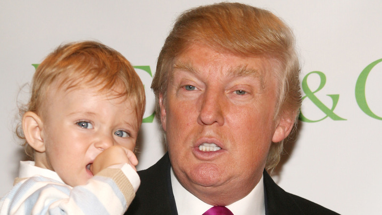 Donald Trump holding Barron Trump