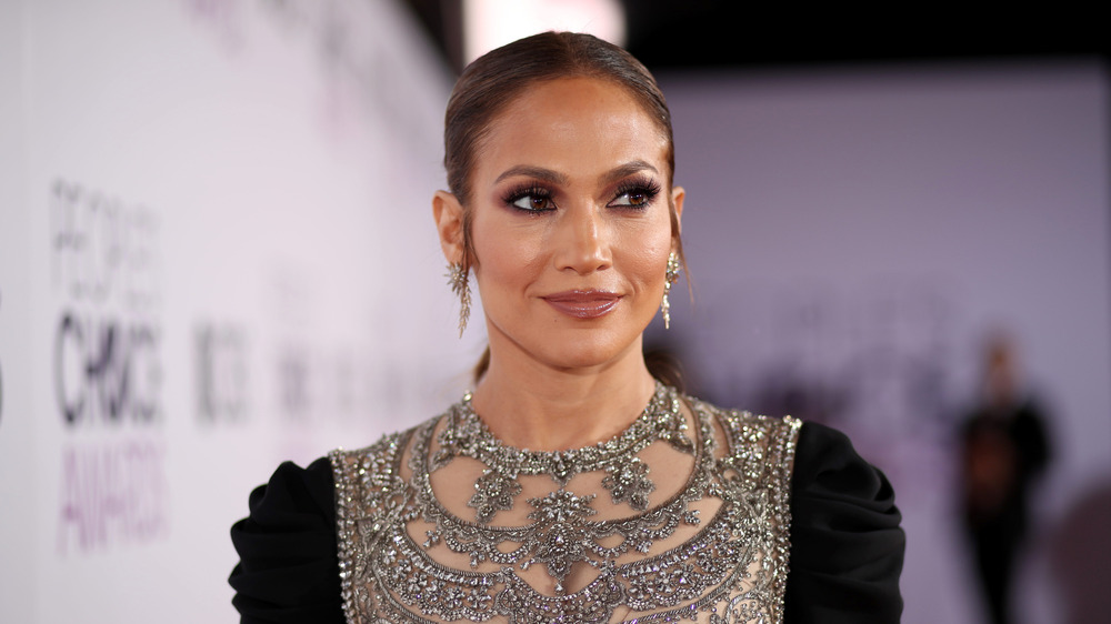 Jennifer Lopez gazing off camera, hair pulled back