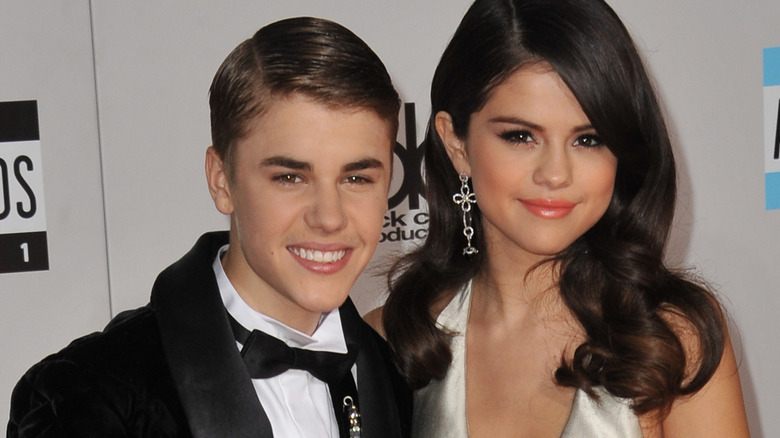 Justin Bieber smiling with Selena Gomez