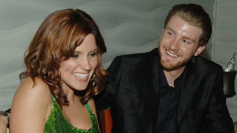 Sophia Bush laughing and Jon Foster smiling