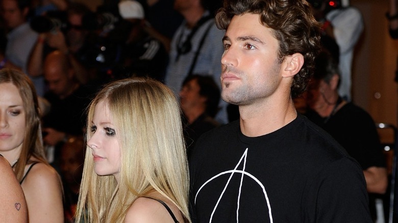 Avril Lavigne standing with Brody Jenner