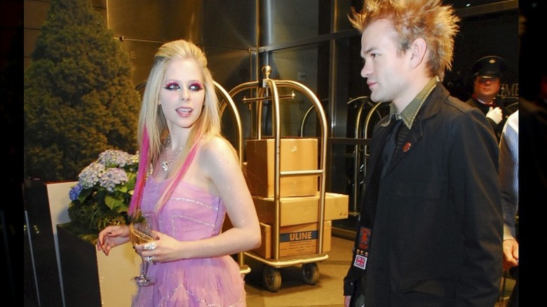 Avril Lavigne walking with Deryck Whibley