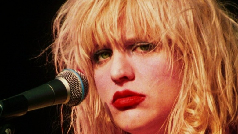 Courtney Love looking sad on stage