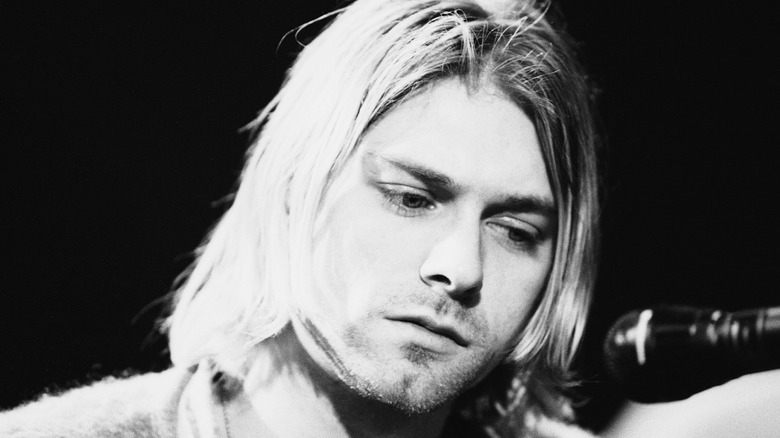 Kurt Cobain looking sad on stage