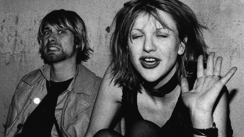 Kurt Cobain and Courtney Love pulling faces