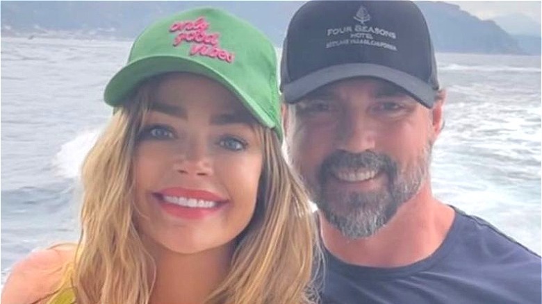 Denise Richards smiling with Aaron Phypers