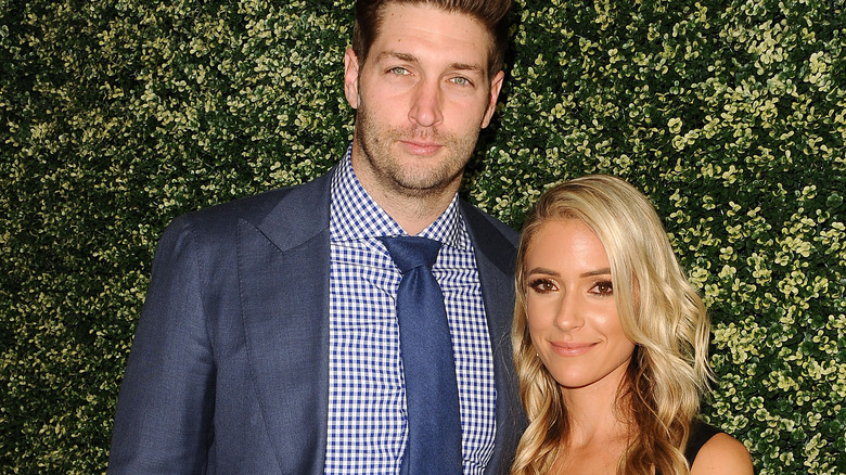 Kristin Cavallari and Jay Cutler, both posing