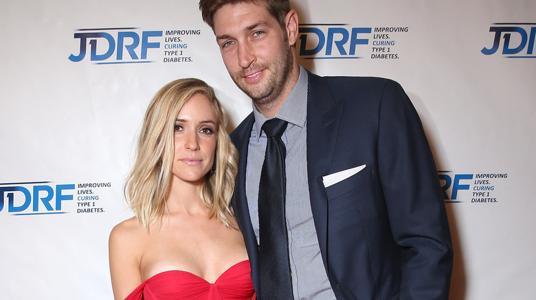 Kristin Cavallari and Jay Cutler, both posing