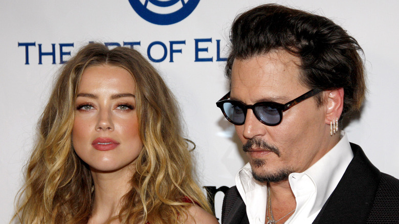 Amber Heard and Johnny Depp at an event 