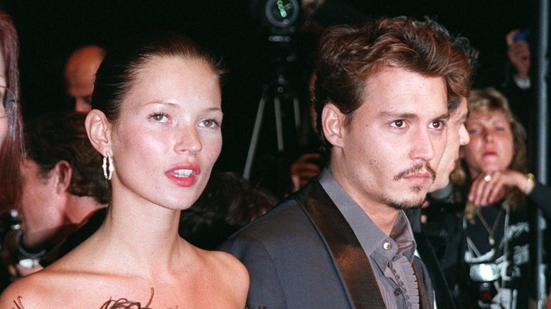 Kate Moss and Johnny Depp at an event 