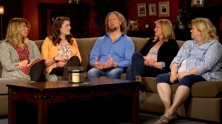 The Brown family sitting on couch