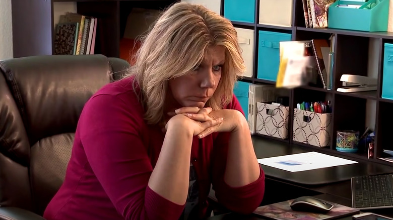 Meri Brown sitting at a desk