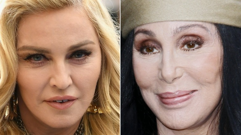 Madonna wearing diamond grills, Cher wearing a hat