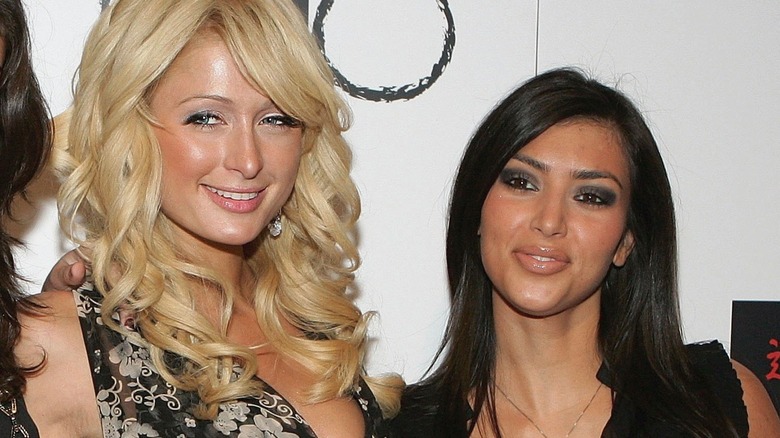 Kim Kardashian and Paris Hilton, both smiling