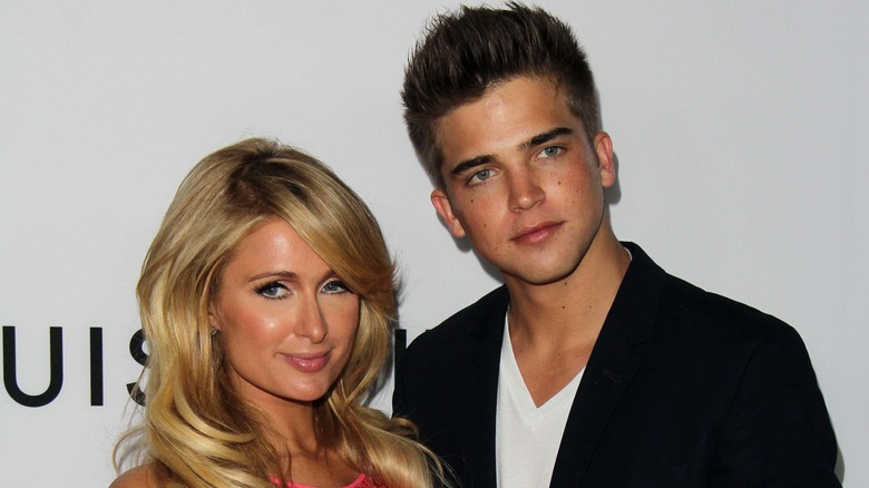 Paris Hilton and River Viiperi, looking serious