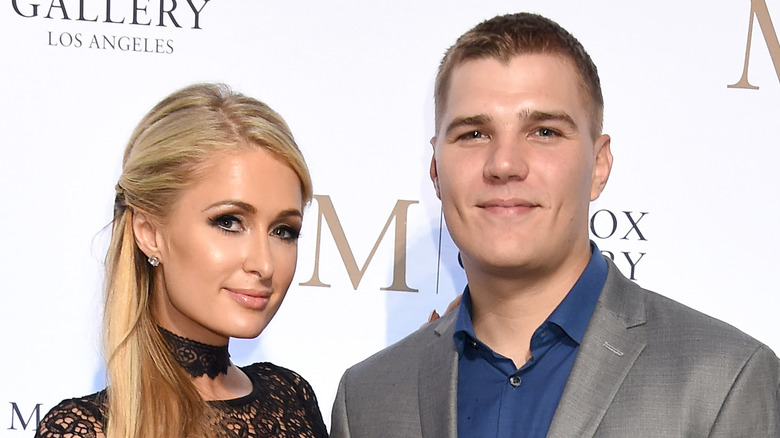 Paris Hilton and Chris Zylka, smiling