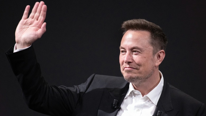 Elon Musk waving hand