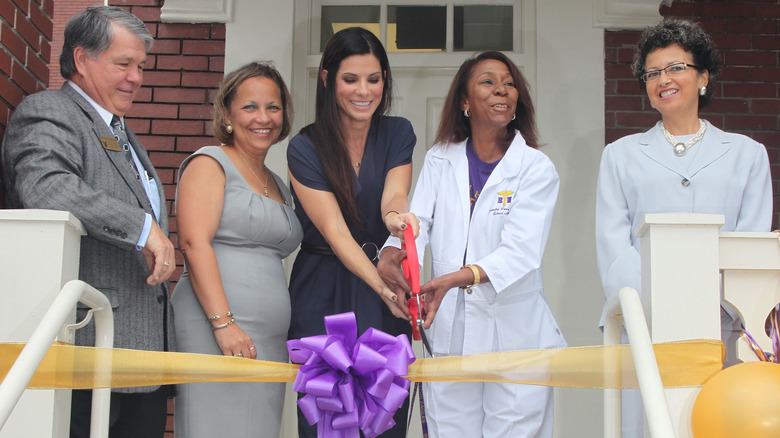 Sandra Bullock cutting yellow ribbon