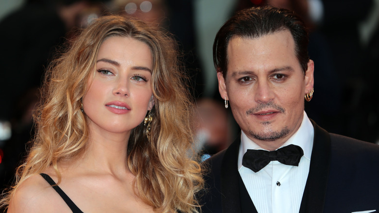 Johnny Depp and Amber Heard pose 