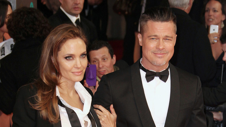Angelina Jolie posing with Brad Pitt