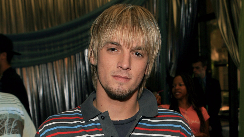 Aaron Carter in a striped polo