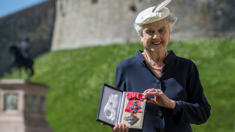 Dame Angela Lansbury in white hat