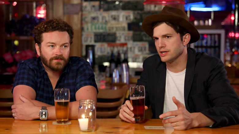 Danny Masterson and Ashton Kutcher sitting