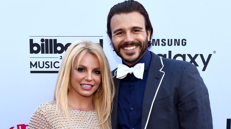 Britney Spears and Charlie Ebersol smiling