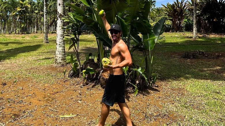 Brody Jenner poses with a coconut