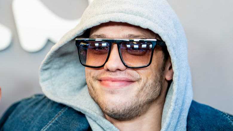 Pete Davidson smiling in shades