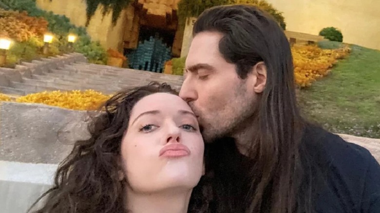 Andrew W.K. kisses Kat Dennings on the forehead