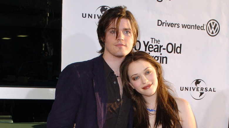 Kat Dennings leans on Ira David Wood IV on red carpet