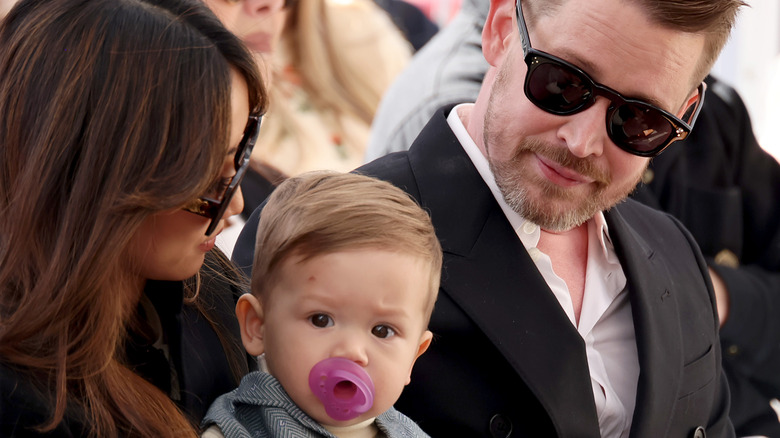 Brenda Song and Macaulay Culkin with their son